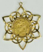 QUEEN VICTORIA GOLD SOVEREIGN PENDANT, Young Head, 1873, in a 9ct gold openwork flowerhead mount,