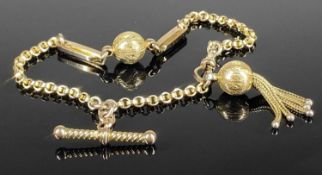 GOLD FANCY CHAIN LINK BRACELET with T-bar and ball tassel, unmarked, testing as 9ct gold, 21cms (l),