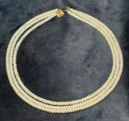 CULTURED FRESHWATER PEARL CHOKER NECKLACE, three strand, with unmarked gold coloured clasp, 44cms (