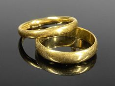 TWO 22CT GOLD WEDDING RINGS, the first size L, 2.9gms, the second size K, 2.7gms (2) Provenance: