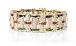 YELLOW & WHITE METAL MULTI-GEM SET BRACELET, encrusted with diamond chips and square-cut emeralds,