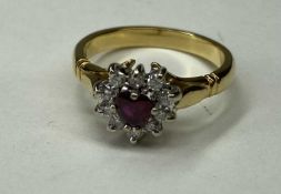 RUBY & DIAMOND CLUSTER RING in heart shape, the central ruby approx. 0.25cts, bordered with small