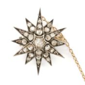 VICTORIAN DIAMOND STAR BROOCH, c. 1890, silver and gold frame set with 29 graduated old rose-cut