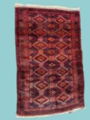 TURKISH THICK PILE WOOLLEN RUG in the Bokhara tradition, finished in blue, red, and ochre, 190 x