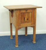 ARTS & CRAFTS PERIOD OAK AND INLAID POT CUPBOARD in the manner of Liberty, having pull-down door