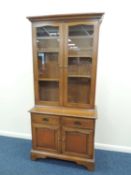 REPRODUCTION MAHOGANY CUPBOARD BOOKCASE, upper section with glazed doors including adjustable