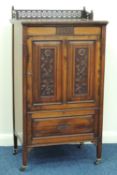 LATE VICTORIAN ROSEWOOD MUSIC CABINET c. 1885, having carved foliate panel doors opening to shelves,
