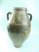 ROMAN-STYLE GLAZED EARTHENWARE TWO-HANDLED VASE / OIL JAR, 48cms (h) Provenance: private