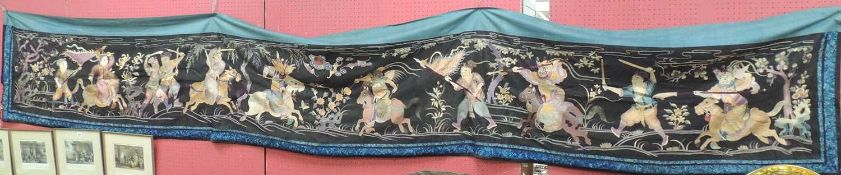 CHINESE EMBROIDERED SILKWORK BANNER, early 20th century, featuring an ensuing battle in coloured