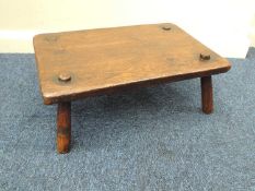 RUSTIC ANTIQUE OAK FOUR-LEGGED STOOL, 18th or 19th century, with rectangular seat, 19 (h) x 48 (w) x