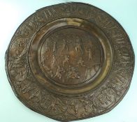 LARGE INDIAN CIRCULAR COPPER PLAQUE, border decorated with panels of figures and animals, centre