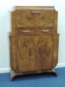 STRIKING ART DECO WALNUT COCKTAIL CABINET, c. 1935, with mirrored birch lined interior, 137 (h) x 94