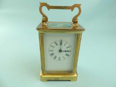 GILDED BRASS CASED FOUR-GLASS CARRIAGE CLOCK, white enamel dial with black Roman numerals, 12cms (h)