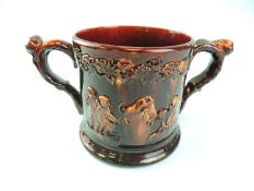 LARGE ROCKINGHAM STYLE TREACLE GLAZED FROG MUG, with twin handles, body decorated in relief with a