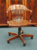 STAINED BEECH SWIVEL ARMCHAIR, 61cms (w) Provenance: private collection Cheshire