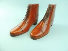 PAIR OF 19TH CENTURY WOODEN BOOTS with stained and carved lace detail, 14cms (l) Provenance: private