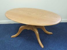 ERCOL BLONDE ELM OVAL PEDESTAL COFFEE TABLE, 52 (h) x 123 (l) x 76cms (d) Provenance: private