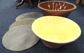 TWO 19TH CENTURY WELSH TERRACOTTA DAIRY BOWLS, with glazed interiors, 55cms and 44cms (diam.);