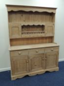 PINE KITCHEN DRESSER, moulded cornice over shaped frieze, shelves with cupboard to either side and