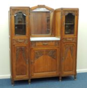 FRENCH ART DECO CARVED OAK VANITY UNIT, centred with a mirror and marble top washstand, flanked by