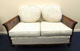 GEORGE V MAHOGANY UPHOLSTERED BERGÈRE SUITE, comprising two-seater settee complete with cushions,