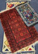 AFGHAN TRADITIONAL RED GROUND PRAYER RUG, 135 x 90cms; also two small flat weave rugs (3)