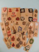 QUANTITY OF MILITARY BADGES MOUNTED ON CARD, including Royal Scots Greys, County Hussars and
