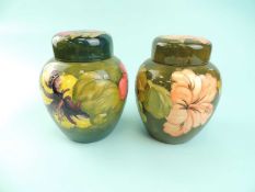TWO MOORCROFT GINGER JARS & COVERS, 'Hibiscus' and 'Coral Hibiscus' patterns, impressed marks to