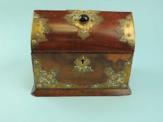 VICTORIAN WALNUT CASKET with gilt metal mounts, agate cabochon stone set to the hinged cover, silk