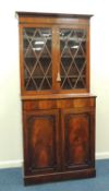 MAHOGANY BOOKCASE CABINET, 19th century, the top with two adjustable shelves, the base fitted with a