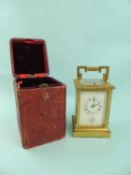 FRENCH BRASS CASED CARRIAGE CLOCK with push-button, repeat hour strike, and alarm, the decorated