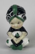 RARE EARLY ROYAL DOULTON BOY WITH TURBAN FIGURE, glazed black, cream, and green, green printed