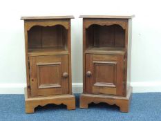 PAIR OF REPRODUCTION MAHOGANY BEDSIDE CABINETS, each having single door with turned knob handle,