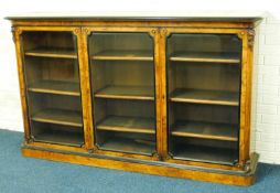VICTORIAN WALNUT BOOKCASE c. 1870, well figured veneers and with ebonised moulded edges, three