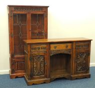 CARVED OAK SIDEBOARD in the manner of Priory, 87 (h) x 143 (w) x 40cms (d); also similar oak linen-