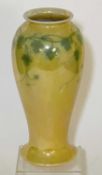 RUSKIN YELLOW LUSTRE GLAZED VASE, green vine leaf design, impressed marks to base, 23cms (h)