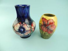 TWO MOORCROFT VASES, 'Anemone' pattern, impressed marks and W. Moorcroft signature to base, 18cms (