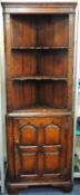 QUALITY REPRODUCTION OAK FREESTANDING OPEN CORNER CUPBOARD, attributed to Titchmarsh & Goodwin,