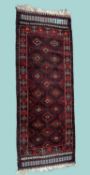 TURKISH WOOLLEN SMALL RUNNER in the Bokhara tradition, 246 x 96cms Provenance: private collection