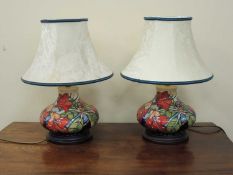 PAIR OF MOORCROFT TABLE LAMPS of squat form, c. 2000, complete with TWO original shades, tube-
