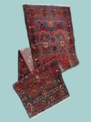 SHIRAZ RED GROUND WOOLLEN RUNNER, 20th century, 426 x 103cms Provenance: private collection Gwynedd