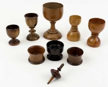 ASSORTED TREEN, 19th century, including a beech goblet, 12.5cms (h); two beech egg cups, double