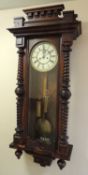 GERMAN WALNUT TWIN WEIGHT WALL CLOCK, c. 1890 (with pendulum and key), 109 (h) x 42cms (w)