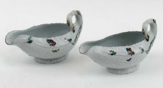 TWO WORCESTER PORCELAIN 'COS LETTUCE LEAF' SAUCEBOATS, c. 1755, painted floral sprays and each
