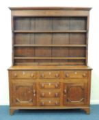 NORTH WALES OAK ENCLOSED DRESSER & PLATE RACK, c. 1810-30, 211 (h) x 160 (w) x 47cms (d) Provenance: