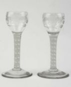 PAIR OF GEORGIAN WINE GLASSES, the bowls engraved with flowers, white air twist stems, 14cms (h)
