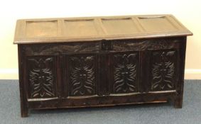 OAK JOINED COFFER, late 17th century, with later carved decoration, 64 (h) x 133 (w) x 56cms (d)