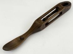 WELSH FOLK ART CARVED WOODEN LOVE SPOON, possibly lime, openwork handle containing a ball, 25cms (l)