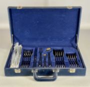 SUISSINE CANTEEN OF STAINLESS-STEEL CUTLERY with gold detail, 24 pieces, in blue case Provenance: