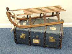 VINTAGE WOODEN SLEIGH, stamped 'Davos', 102cms (l); together with a vintage wooden bound trunk (2)